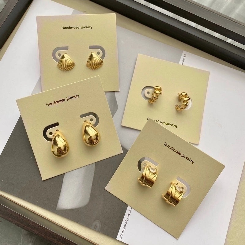 Black Logo Tag Earrings on Wrapping Card | Jewelry Accessories