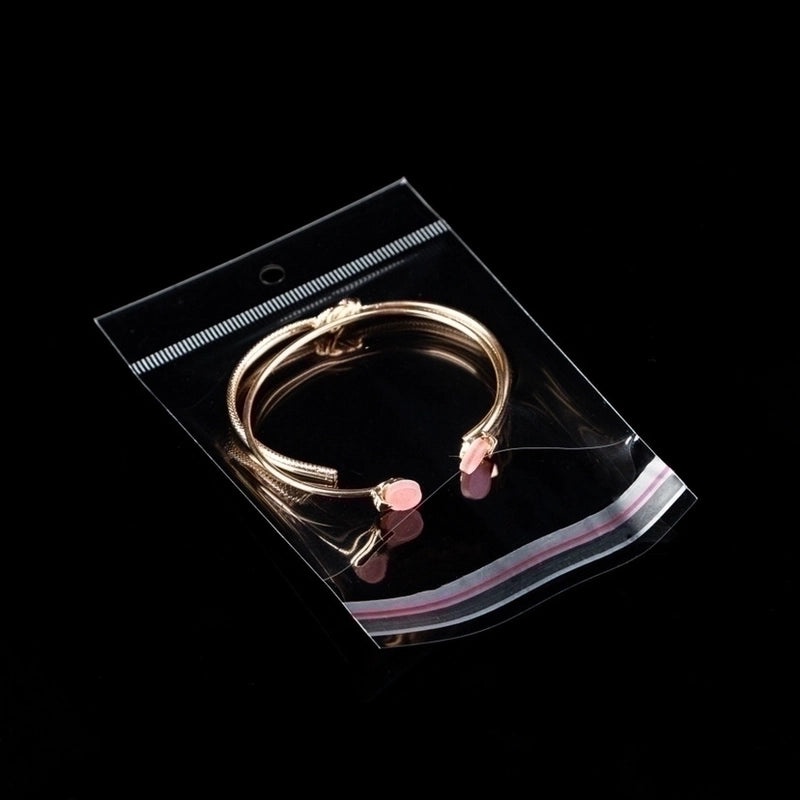 Black Logo Tag Earrings on Wrapping Card | Jewelry Accessories