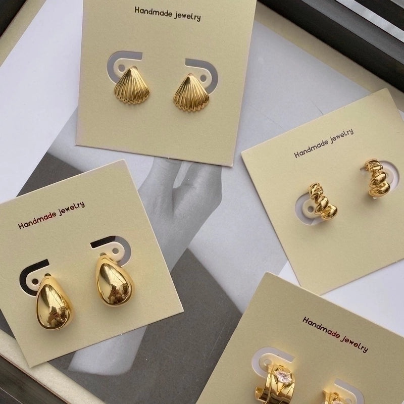 Black Logo Tag Earrings on Wrapping Card | Jewelry Accessories